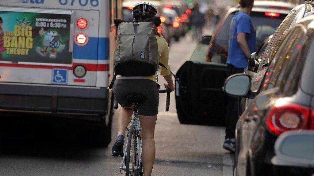 cars parked next to bike lane