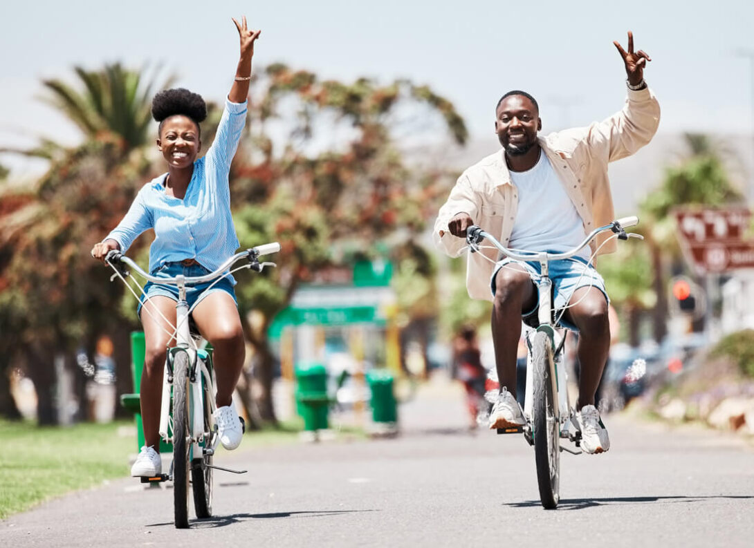 A couple cycling on the street