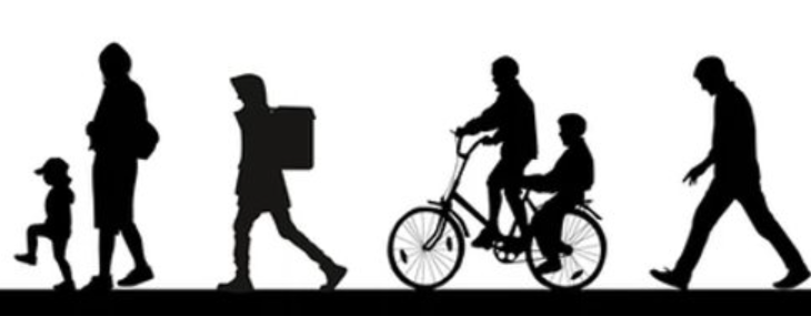 People walking and biking on a pavement