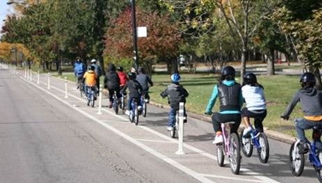 Children biking on protected bike lane