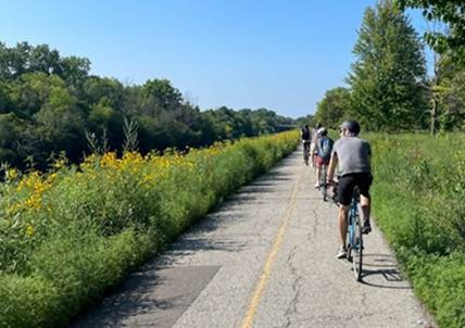 Cyclists riding on a paved trail