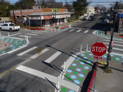 Painted curb extensions with bollards to shorten crossing distance for pedestrians